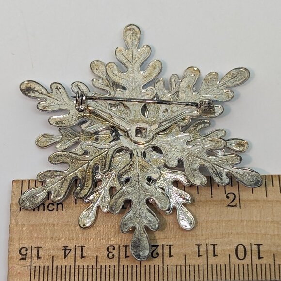 Vintage Silver-Tone Snowflake Brooch With Blue Rhinestone Accent - Picture 2 of 2